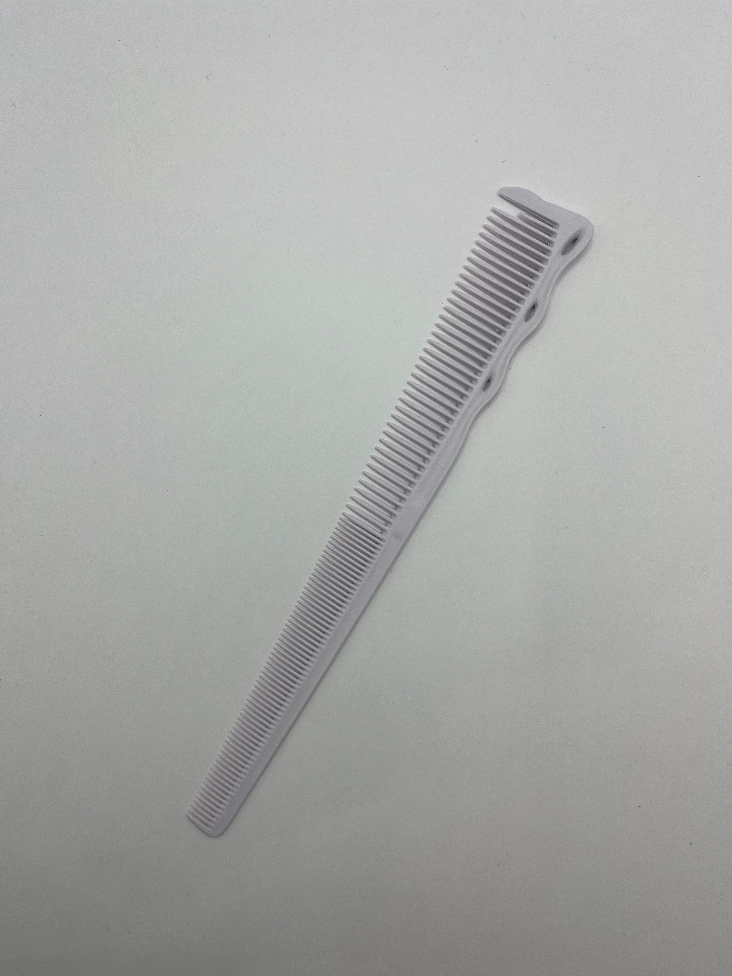 the tactile grip thin end taper barber comb white
